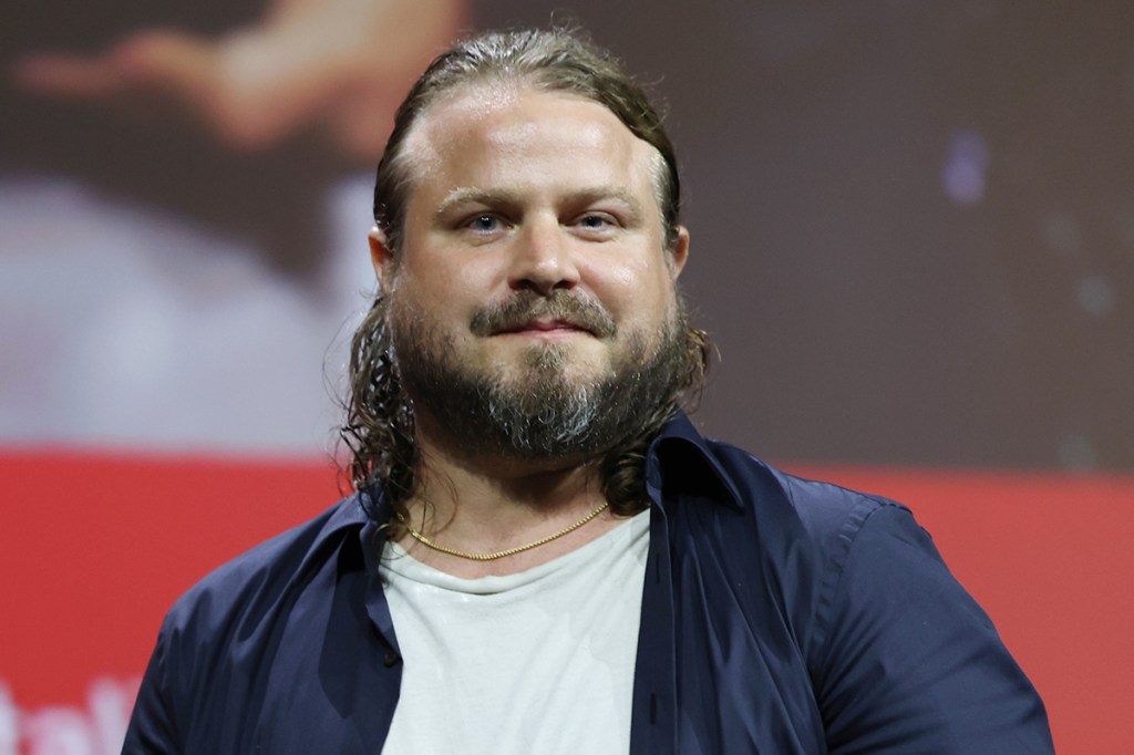 VENICE, ITALY - SEPTEMBER 07: Brady Corbet accepts the Silver Lion for best director for "The Brutalist" onstage during the 81st Venice International Film Festival at Sala Grande on September 07, 2024 in Venice, Italy. (Photo by Vittorio Zunino Celotto/Getty Images)