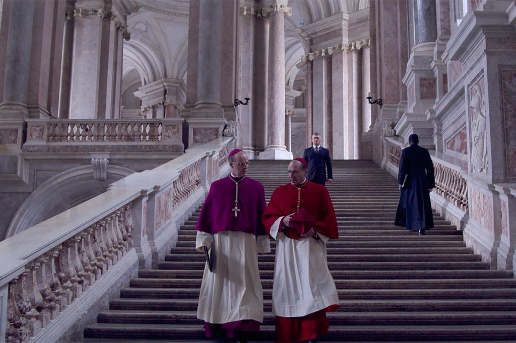 (L to R) Brían F. O'Byrne as Cardinal O'Malley and Ralph Fiennes as Cardinal Lawrence in director Edward Berger's CONCLAVE, a Focus Features release. Credit: Courtesy of Focus Features. © 2024 All Rights Reserved.