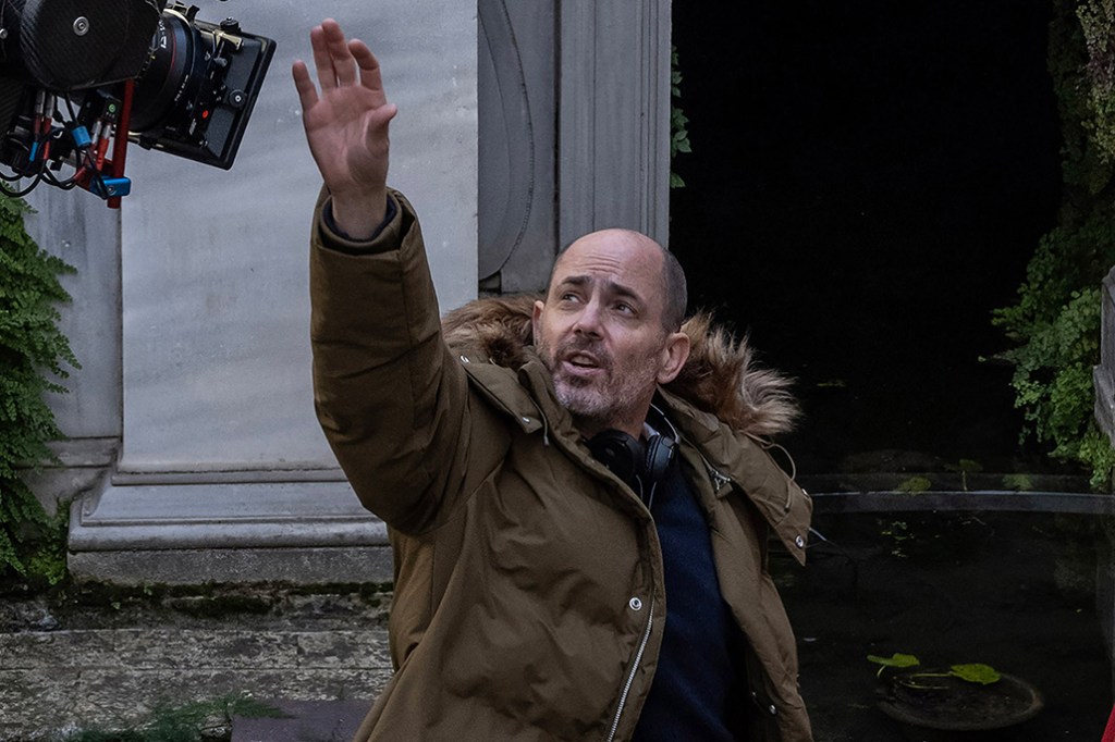 (L to R) Director Edward Berger and actor Ralph Fiennes on the set of CONCLAVE, a Focus Features release. Credit: Philippe Antonello/Focus Features ©2024 All Rights Reserved.