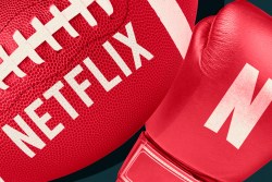 A football and a boxing glove with the Netflix logo on them