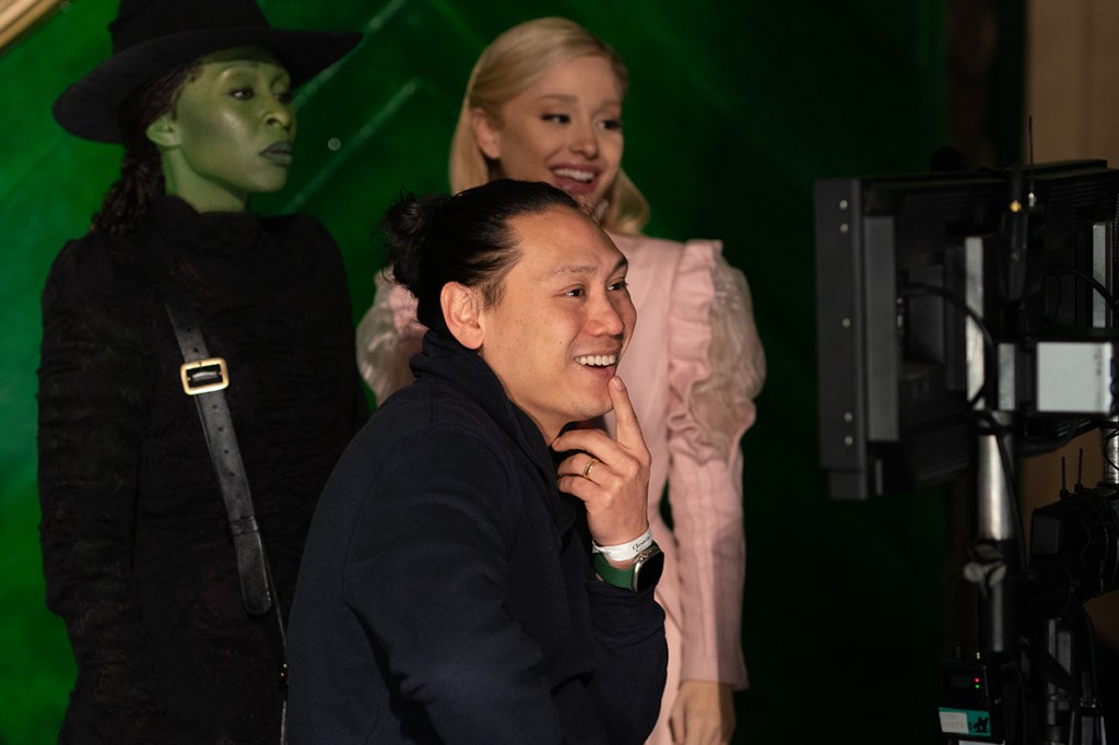 Cynthia Erivo, Ariana Grande and Director Jon M. Chu on the set of WICKED, from Universal Pictures